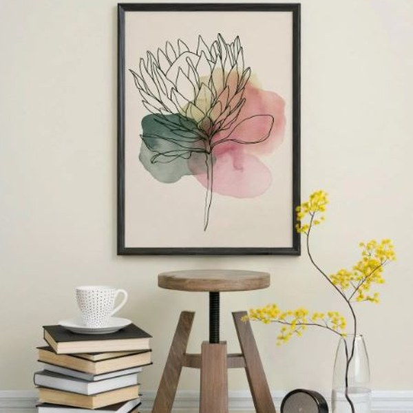Framed botanical line-art print of a protea with soft watercolour washes